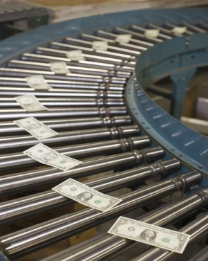 conveyor belt with dollar bills