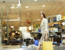 woman with shopping bags at mall